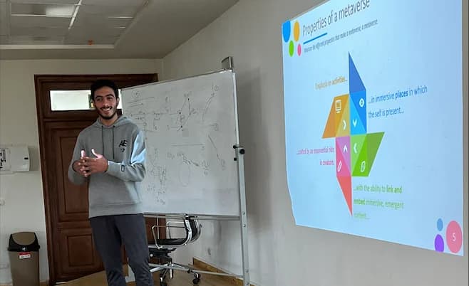A picture of me giving a lecture about Blockchain, crypto-currencies, and the Metaverse